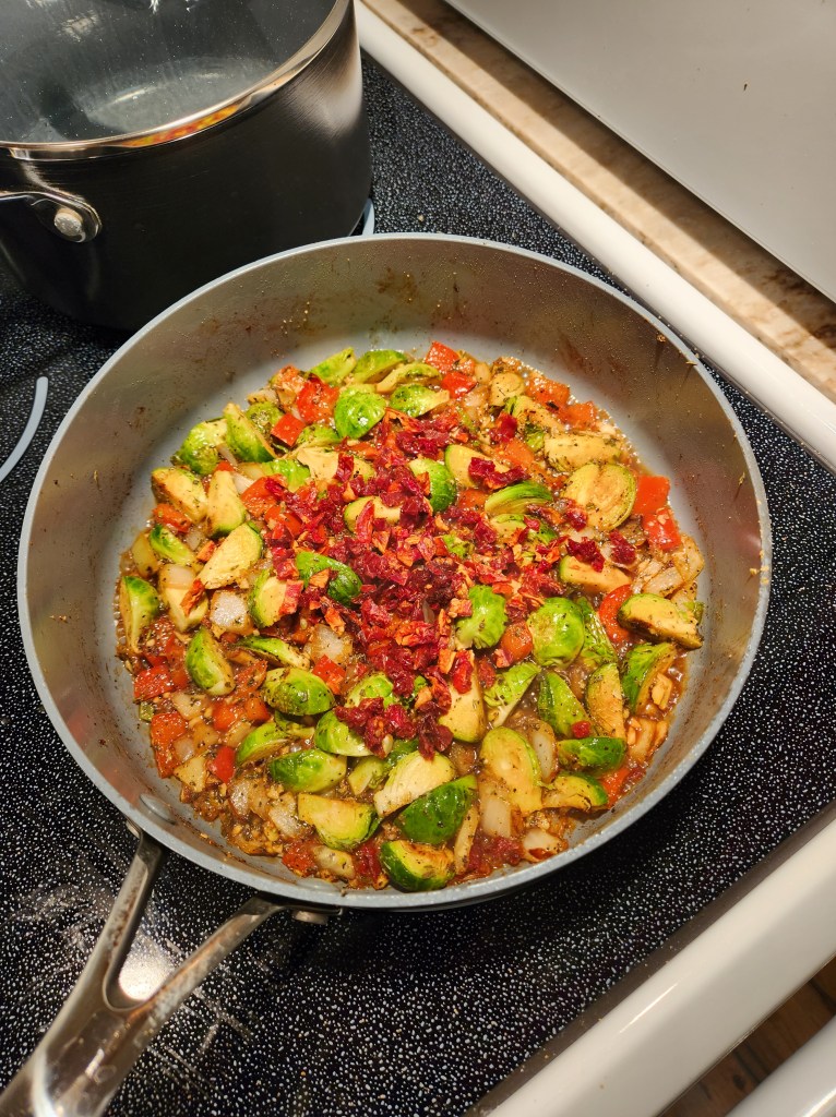 A pan of sauteed zucchini and peppers ready to be served.